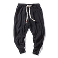 men's relaxed fit tapered harem trousers in black