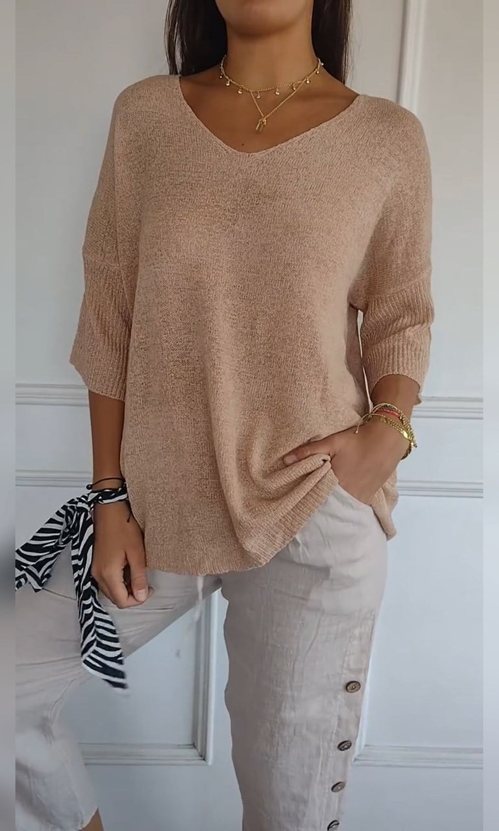 women's oversized v-neck knit top in apricot